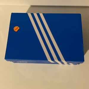 Tresc run solar black Adidas shoes.